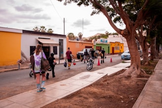 a group of people walking down a street