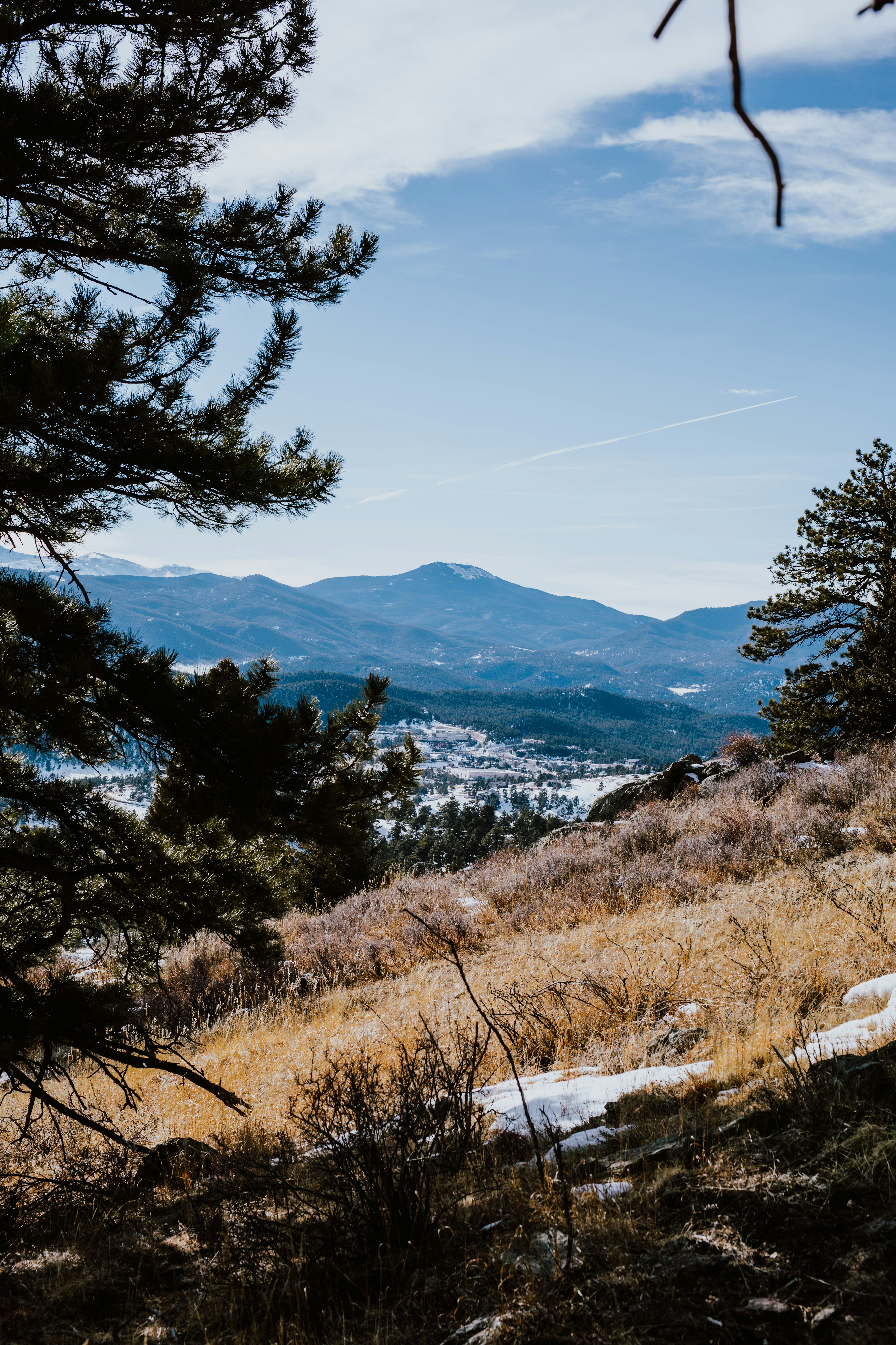 a view of the mountains from a hill