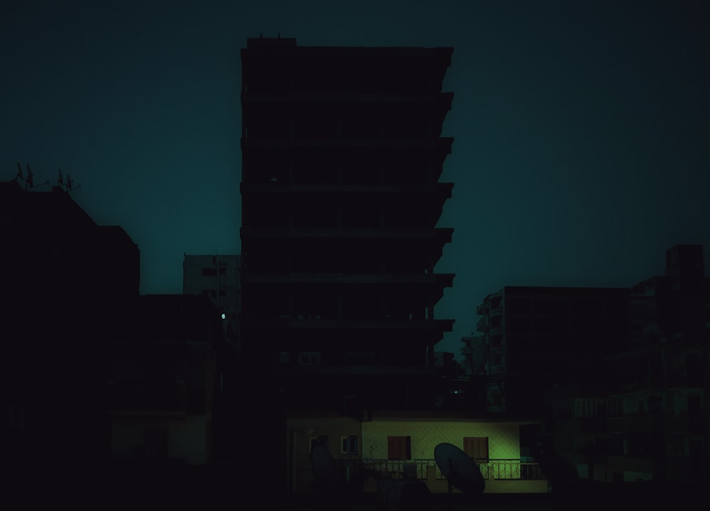 a dark picture of a building at night