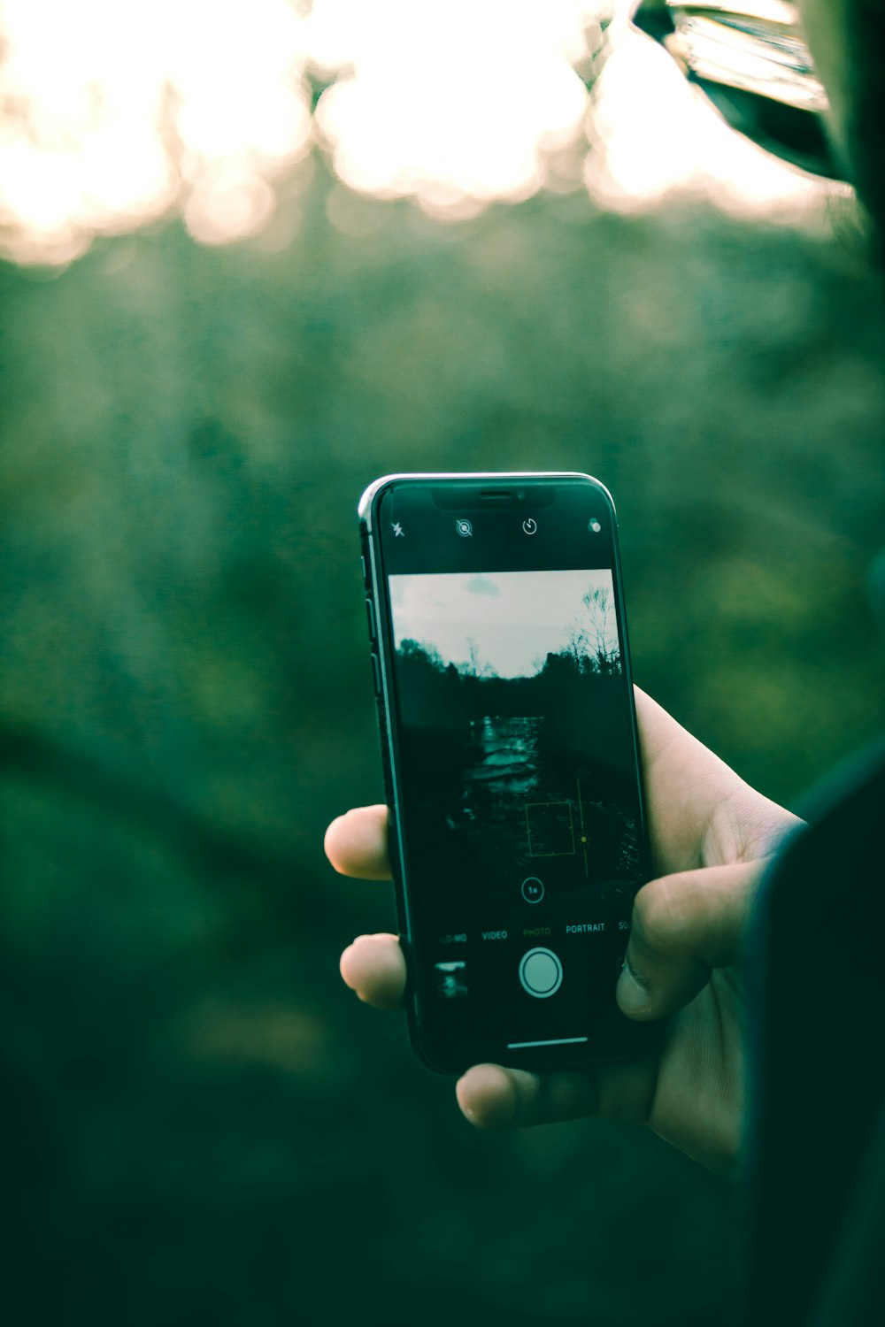 a person holding a cell phone in their hand