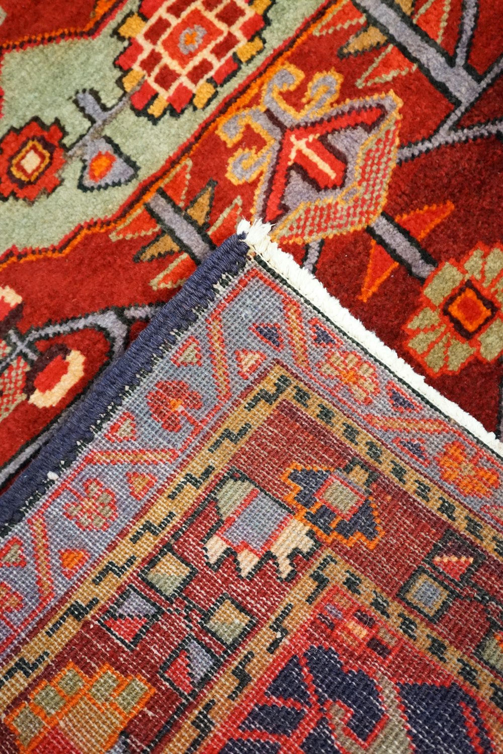 a close up of a rug with different colors