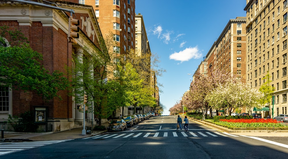 a couple of people that are standing in the street