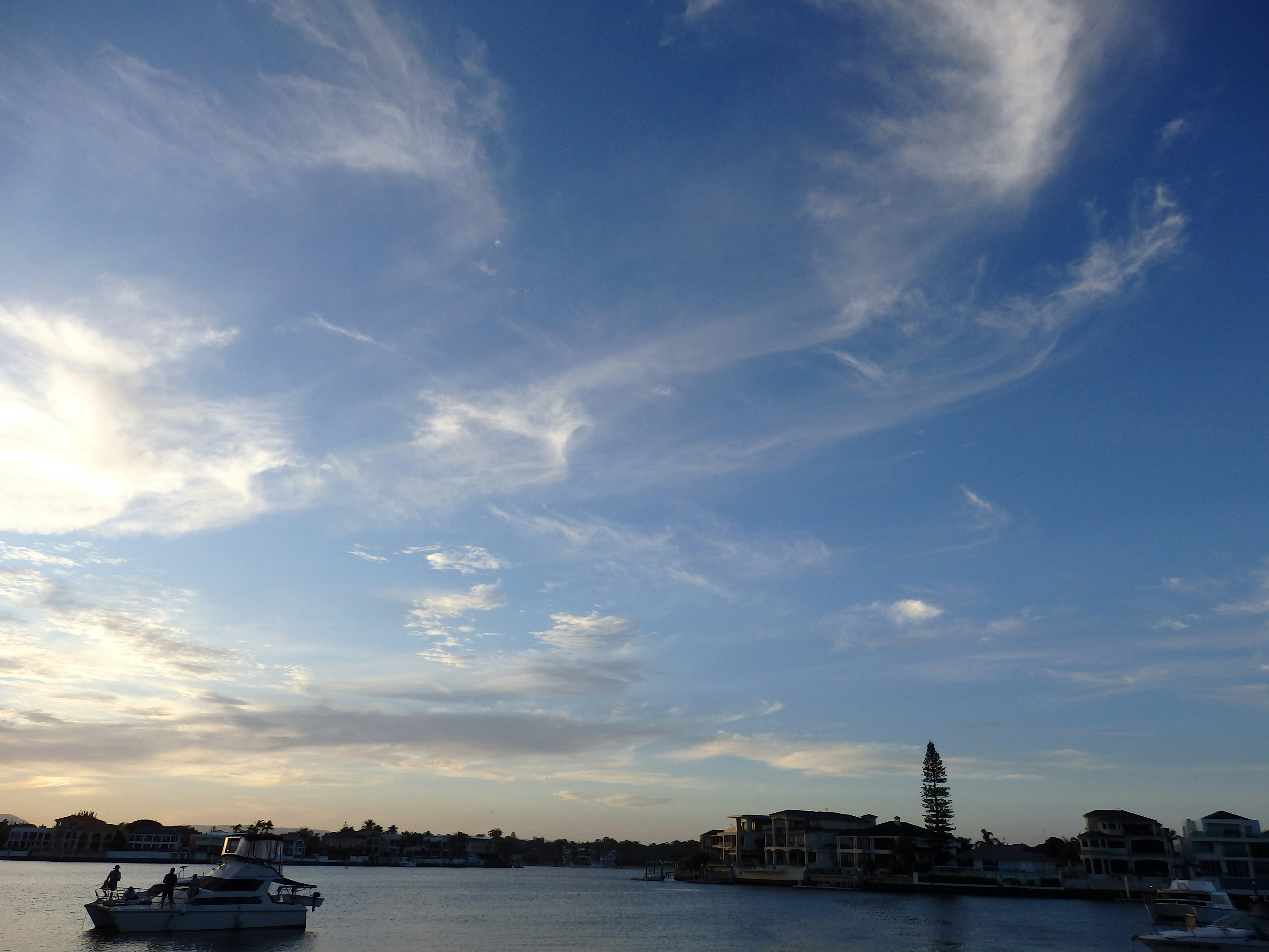 a body of water with boats floating on top of it