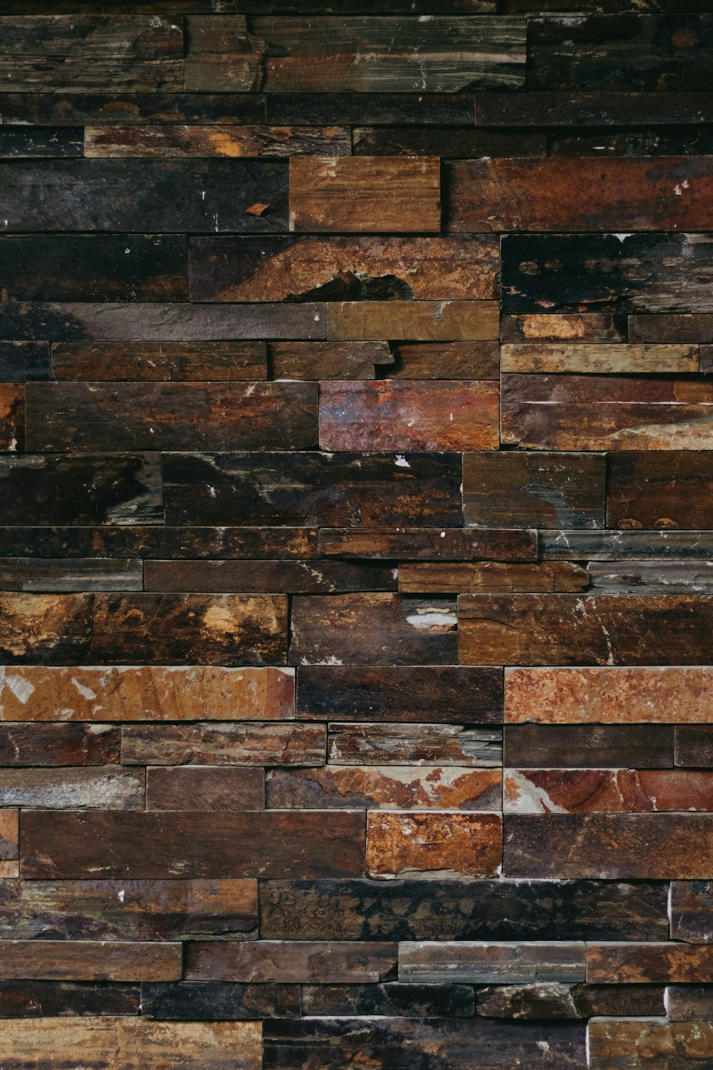 a close up of a wall made of wooden planks