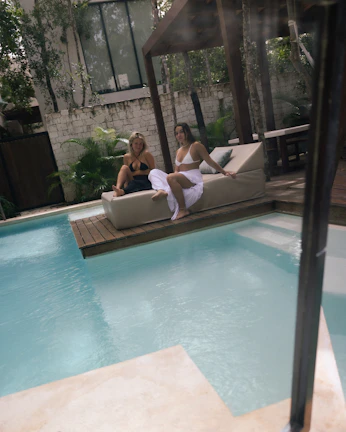 Couple enjoying a relaxing spa session surrounded by lush greenery