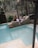 Couple relaxing at a lavish poolside resort.