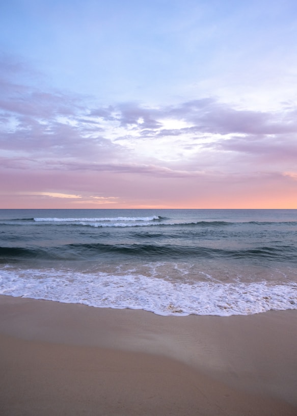 a beach with waves coming in to shore