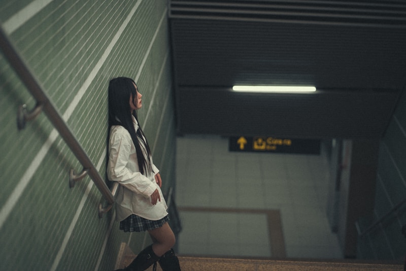 Confident Japanese woman on stairs