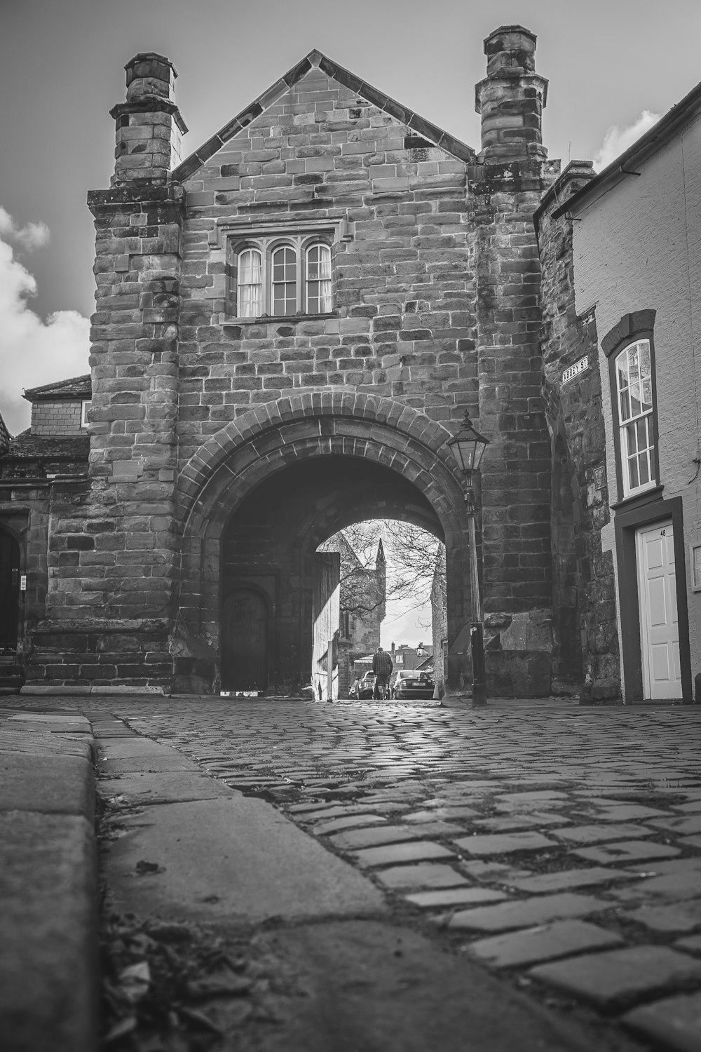 a black and white photo of a brick building