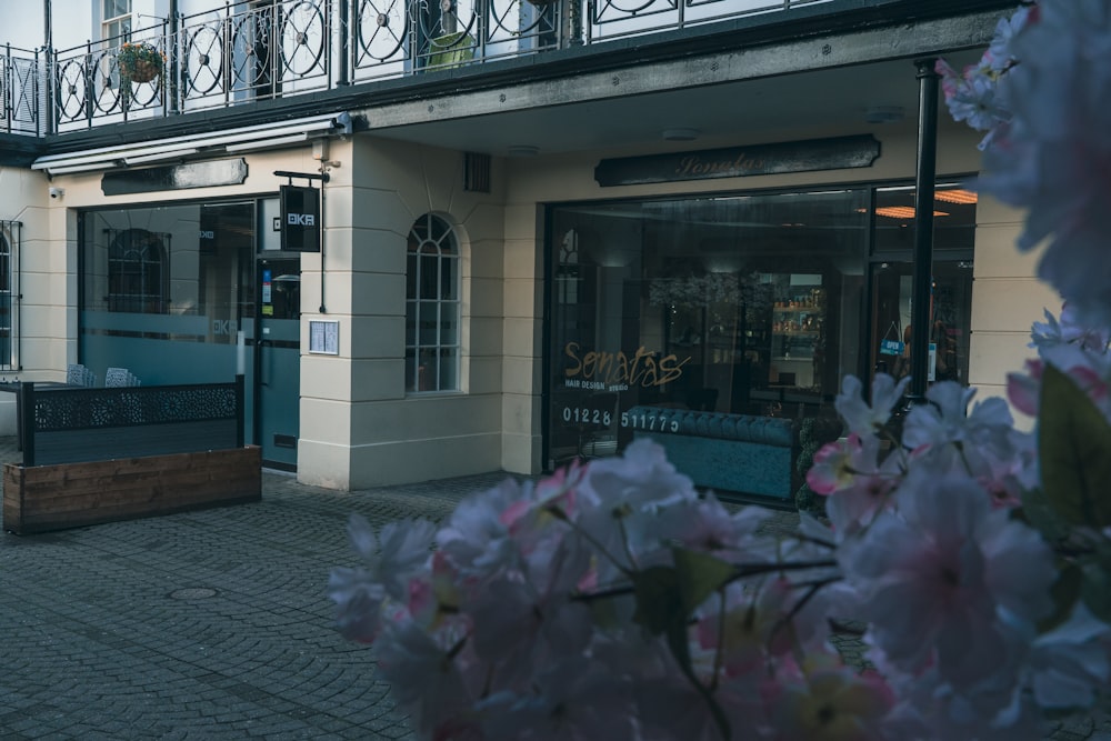 a building with a bunch of flowers in front of it