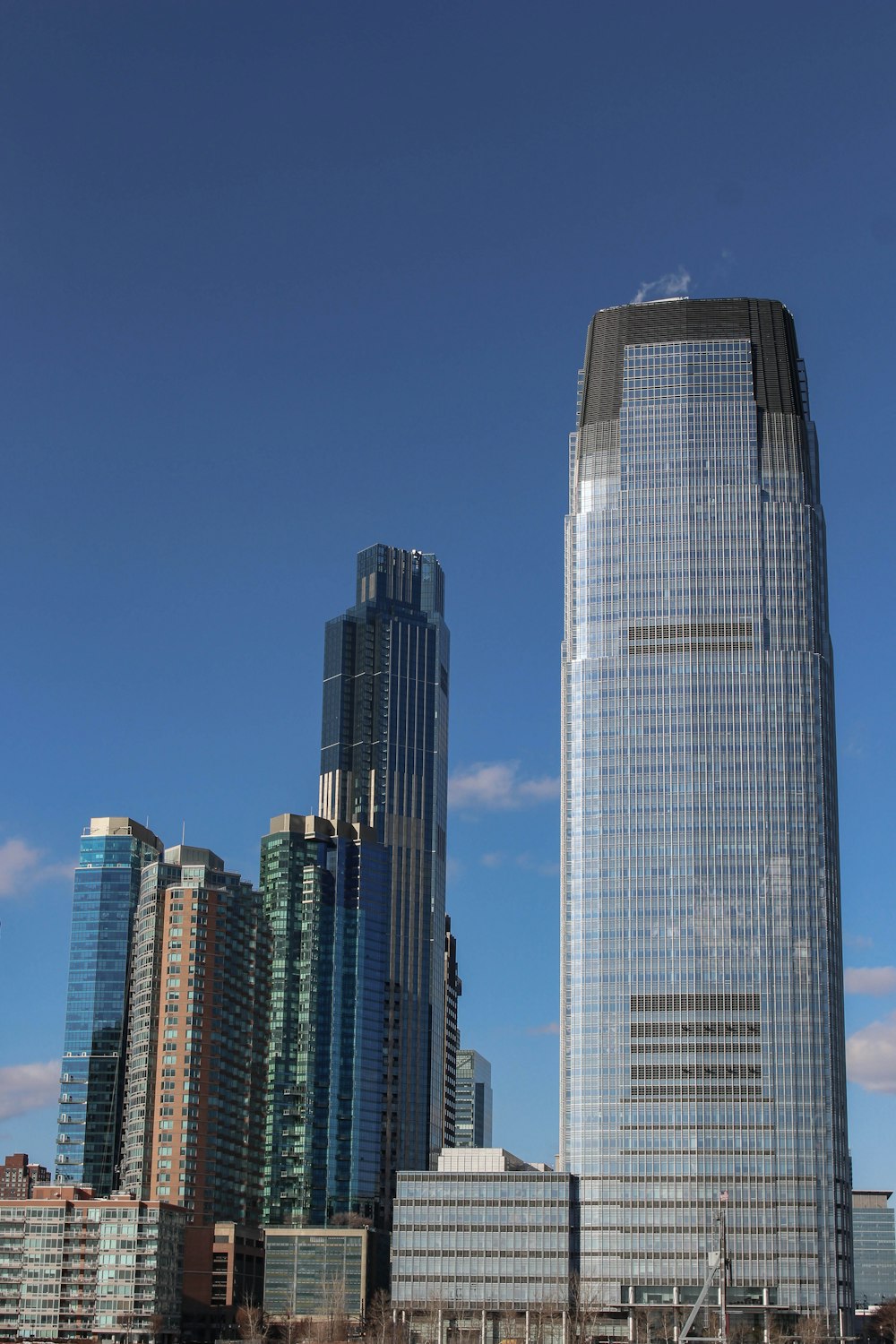 a tall building sitting next to a body of water