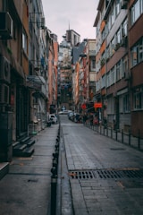 A neighborhood street showing a mix of homes and small businesses.