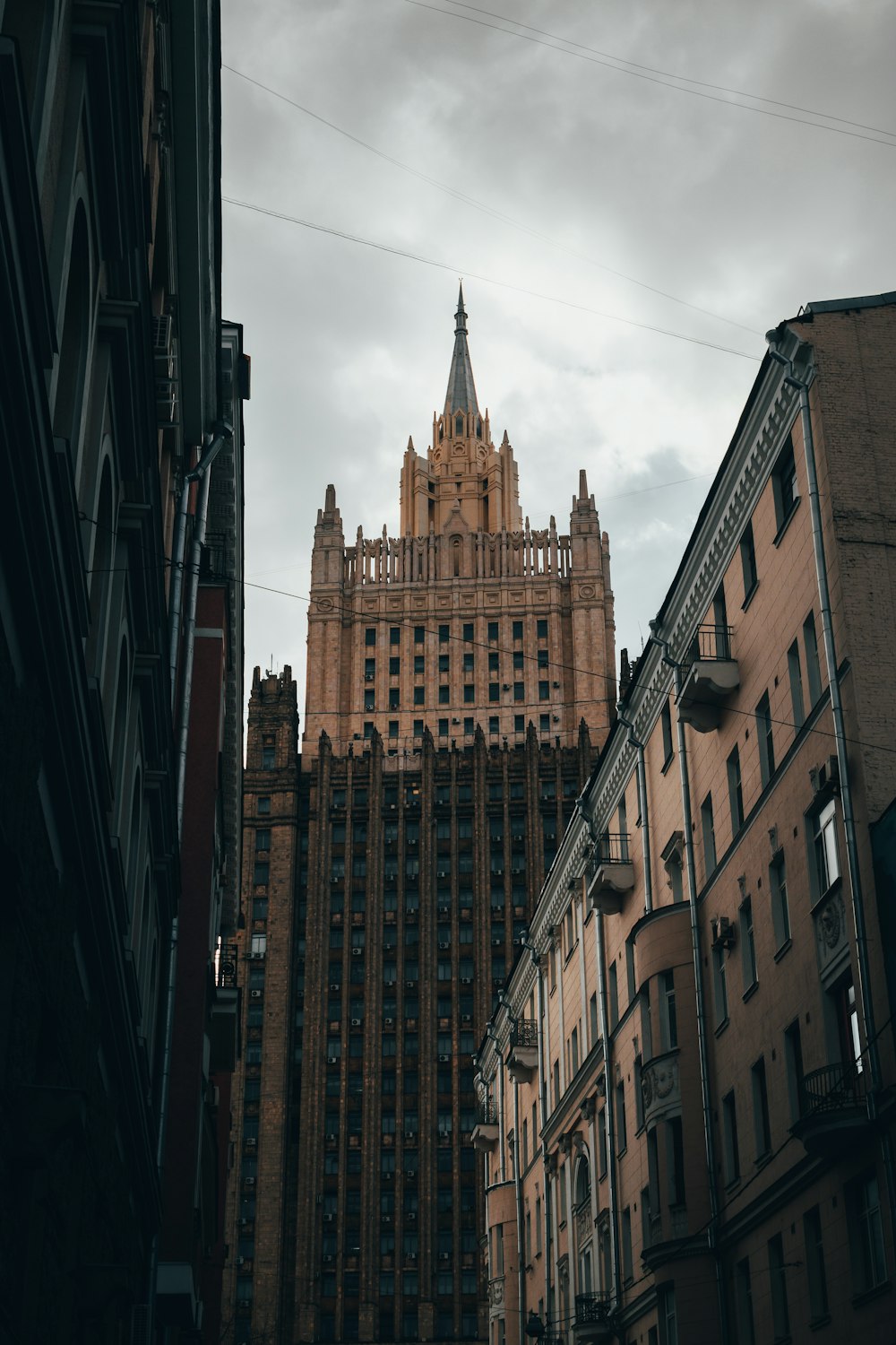 a very tall building towering over a city