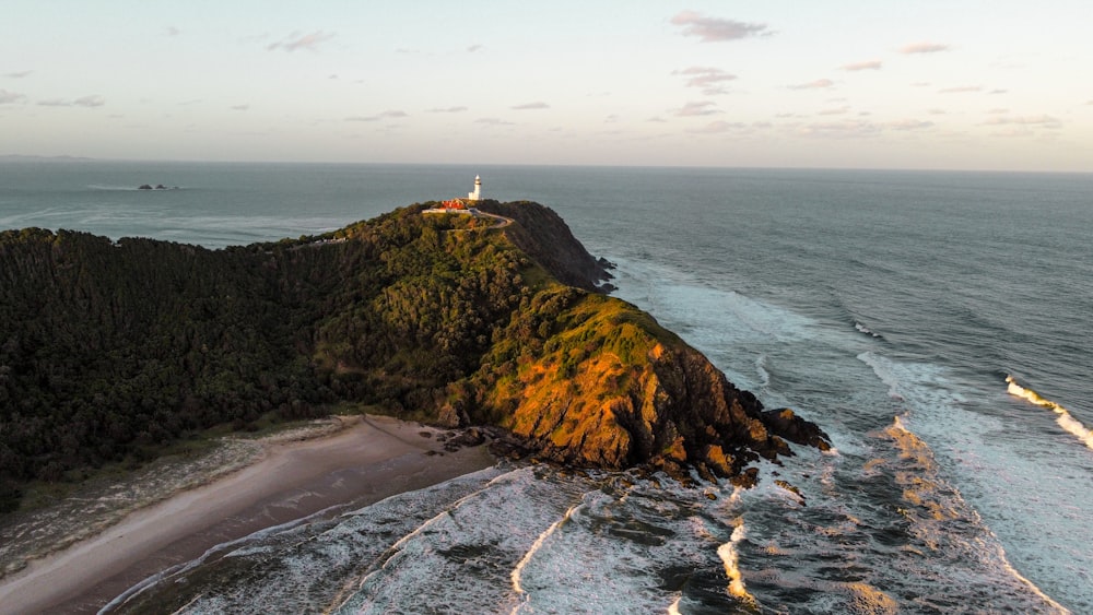 an aerial view of a lighthouse on a small island