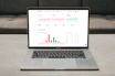 A snapshot of a laptop displaying Sovereign Insight’s latest analysis on global conflicts with charts and maps.
