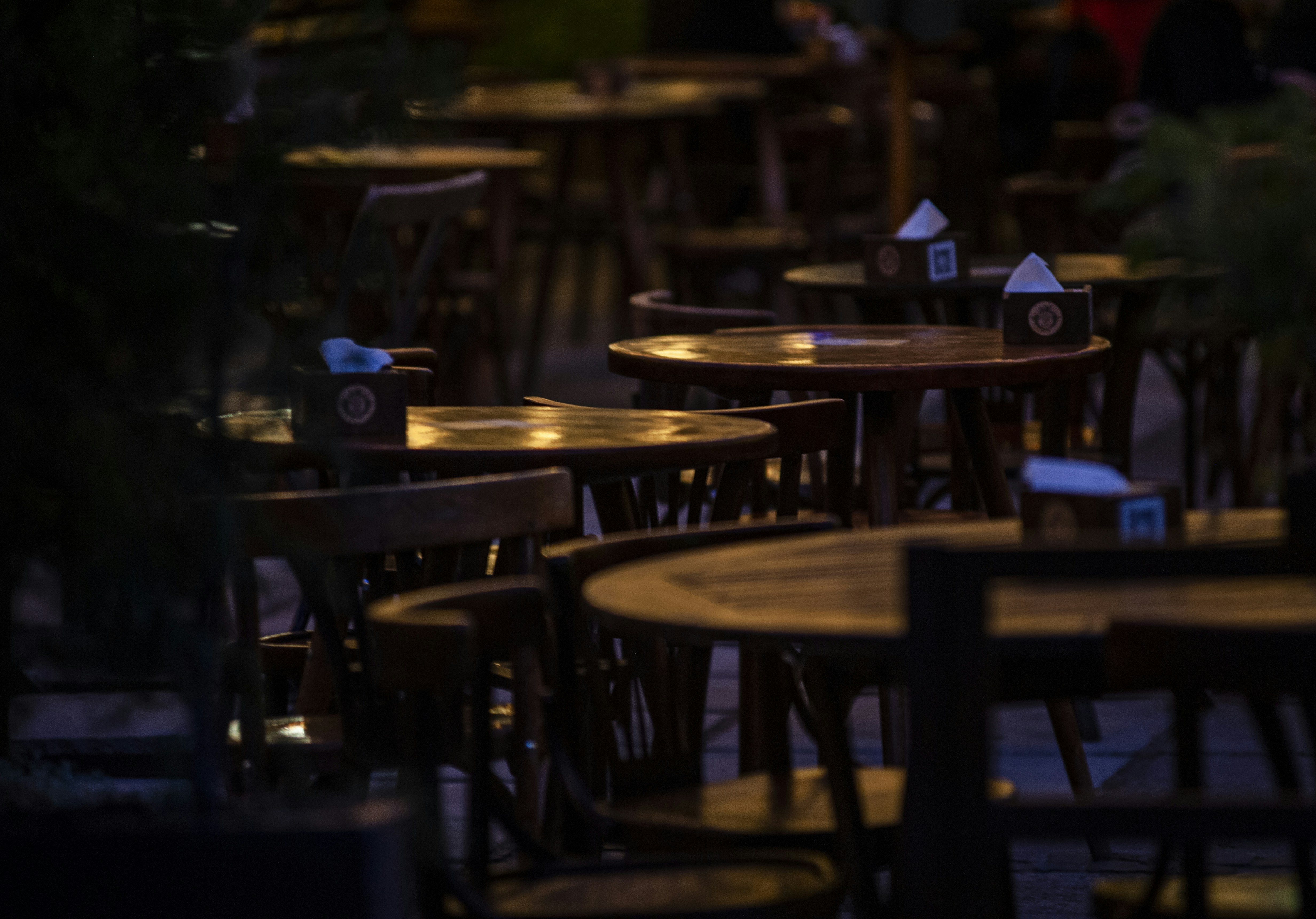 a row of wooden tables sitting next to each other