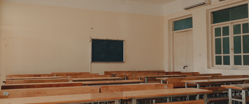 An empty Clark County style classroom with student desks lined up before the school day starts