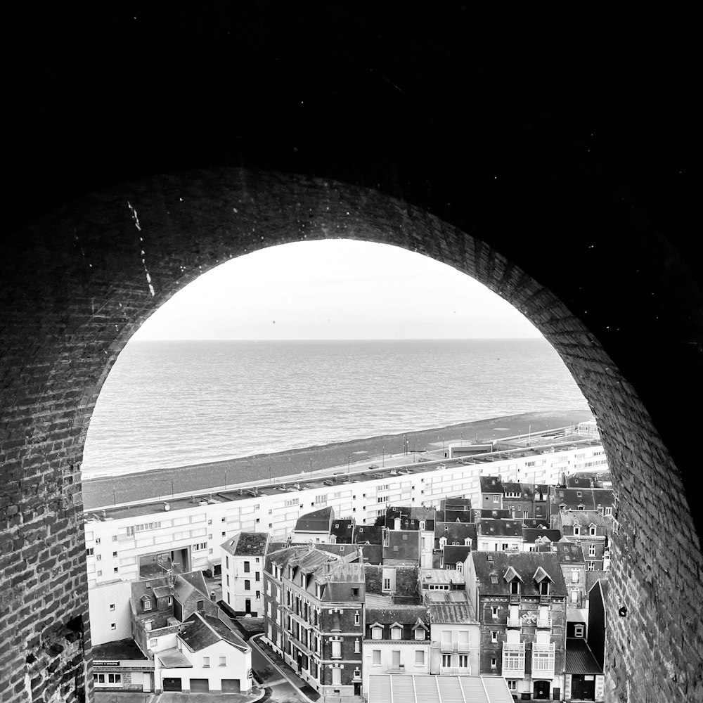 a black and white photo of a view of a beach