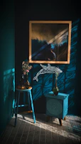 A peaceful therapy room with soft blue accents and soothing artwork on the walls.