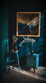 A peaceful therapy room with soft blue accents and soothing artwork on the walls.