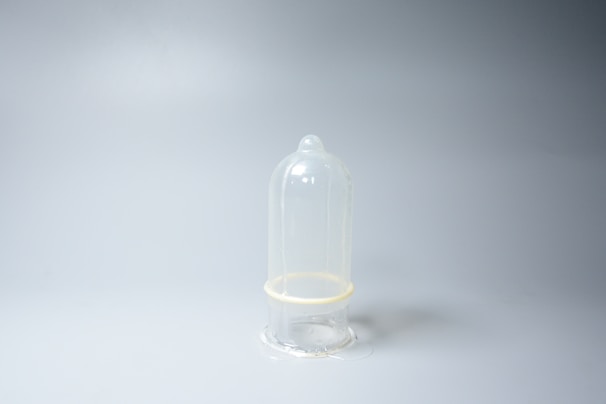 Close-up of various high-quality condoms arranged neatly to highlight texture and packaging.