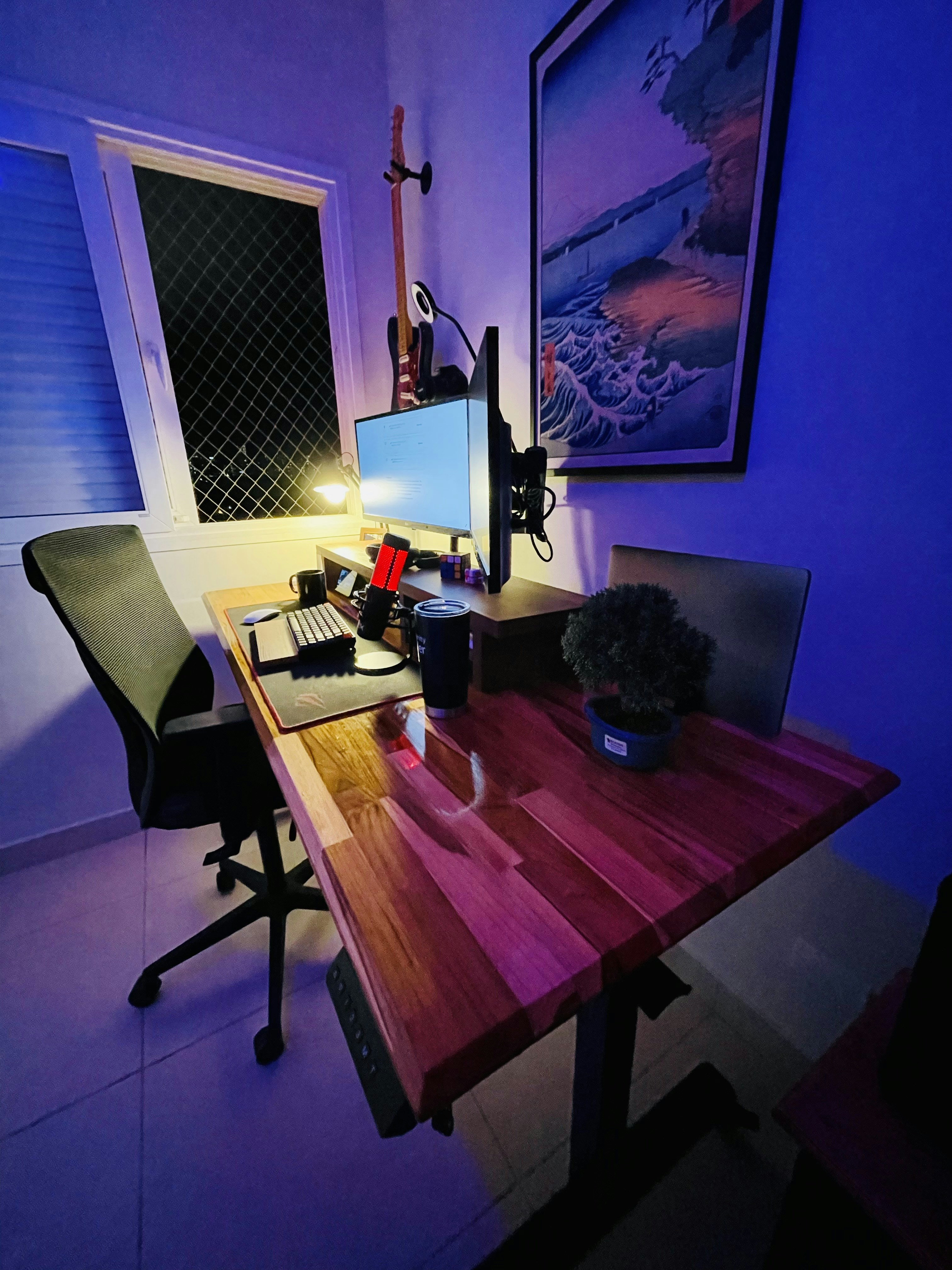 High-end gaming setup with RGB lighting, premium peripherals on a dark desk with neon glow, cyberpunk aesthetic