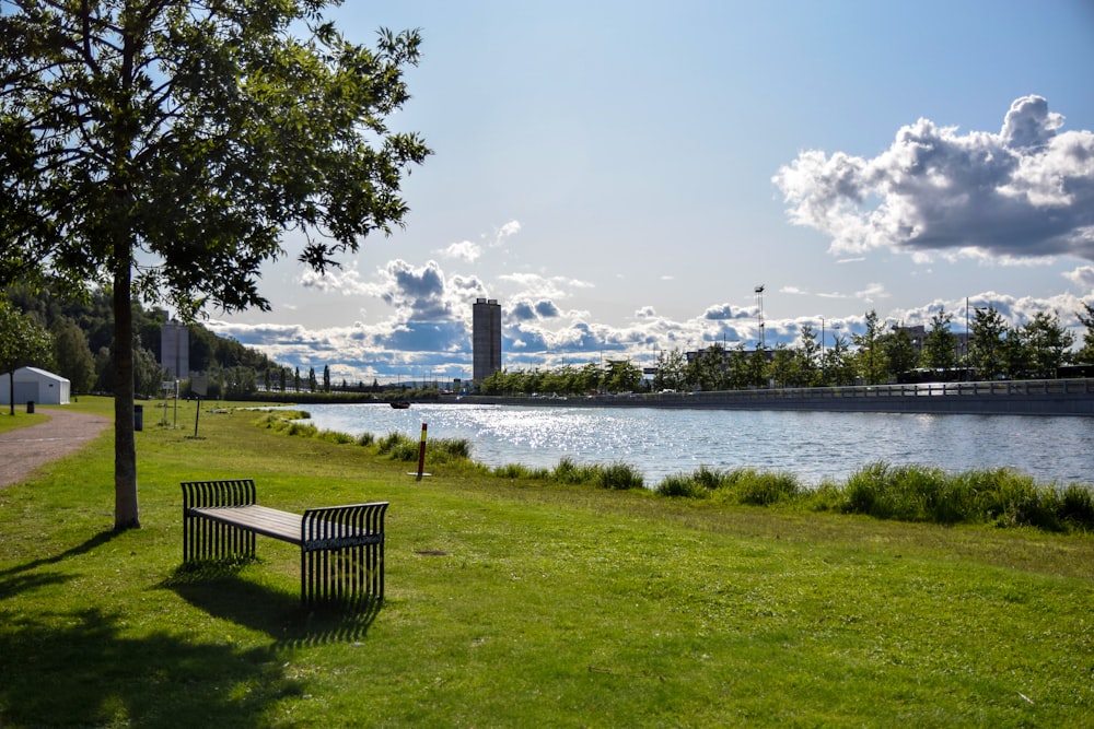 a park bench next to a body of water