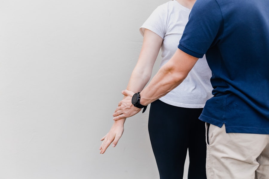 Clinician performing a hands-on postural and movement assessment