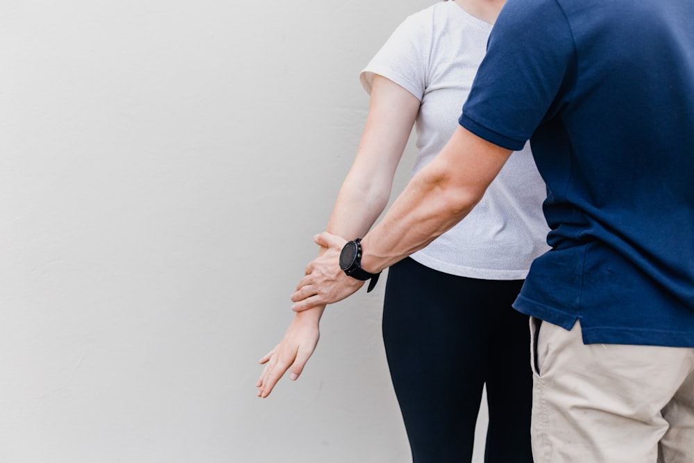 a man and a woman standing next to each other