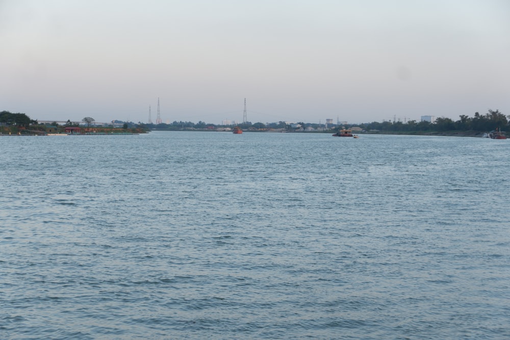 a body of water with boats floating on it