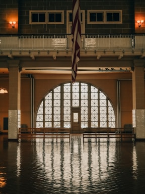 a large room with a flag hanging from the ceiling