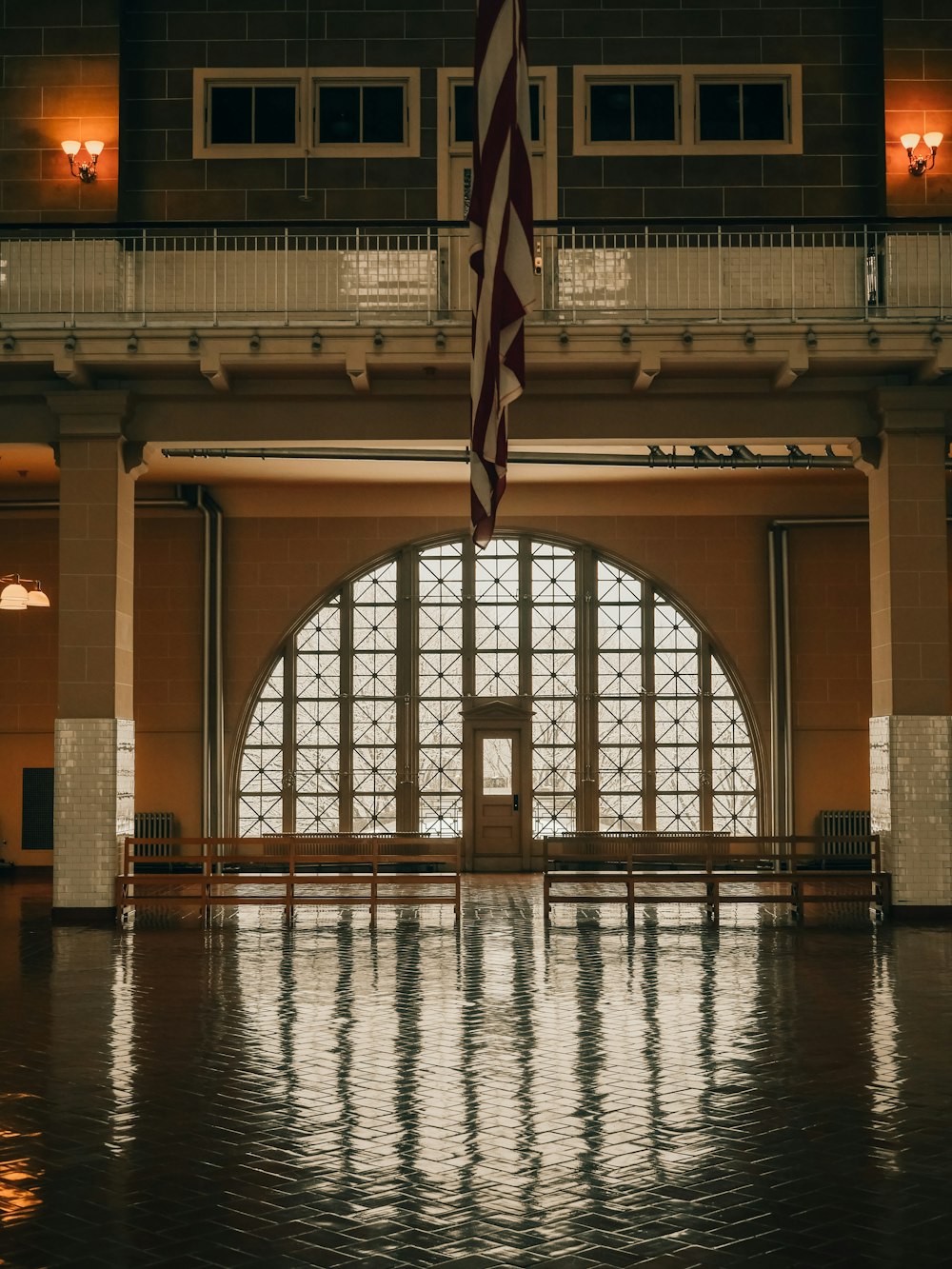 a large room with a flag hanging from the ceiling