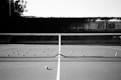 a black and white photo of a tennis court