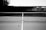 a black and white photo of a tennis court