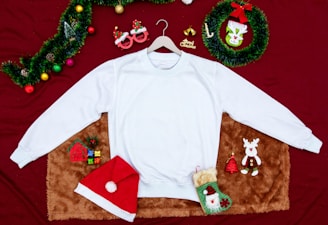 A cozy scene featuring a stylish t-shirt displayed on a wooden table with festive decorations.