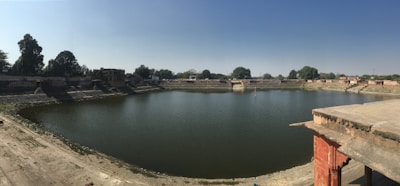 A large water reservoir surrounded by greenery, showcasing its capacity and utility.