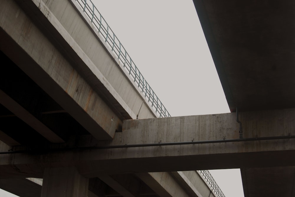 a traffic light on the side of a bridge