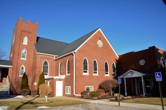a red brick church with a clock tower
