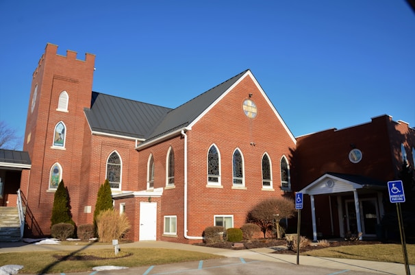 a red brick church with a clock tower