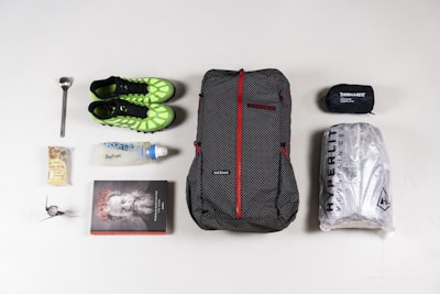 the contents of a backpack laid out on a table