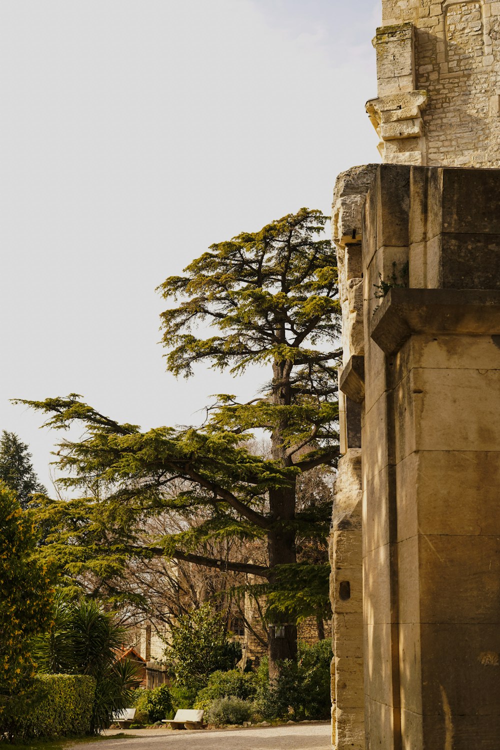 a stone building with a clock on the front of it