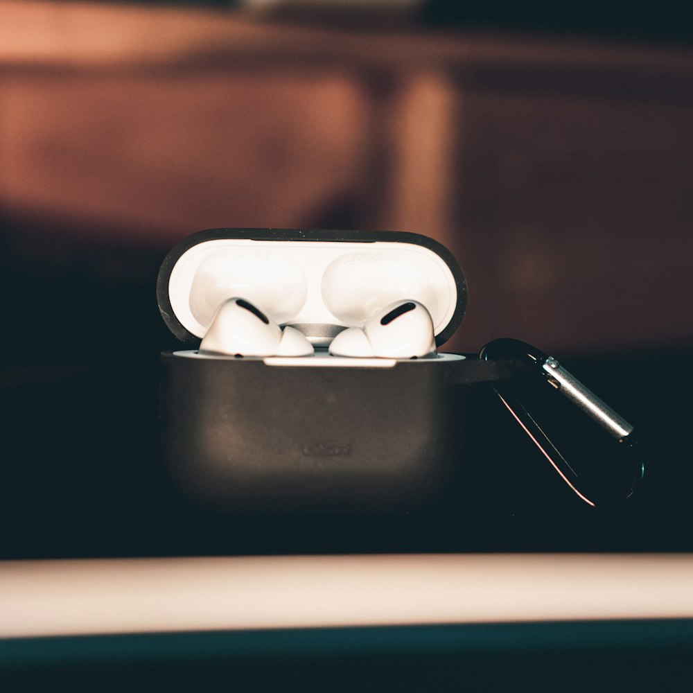 a couple of ear buds sitting on top of a table