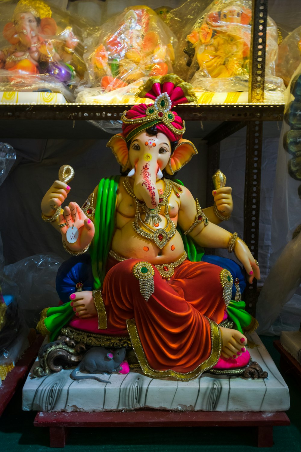 a statue of a ganesh sitting on a table