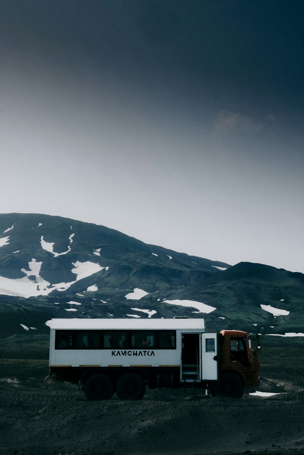 a bus that is sitting in the dirt