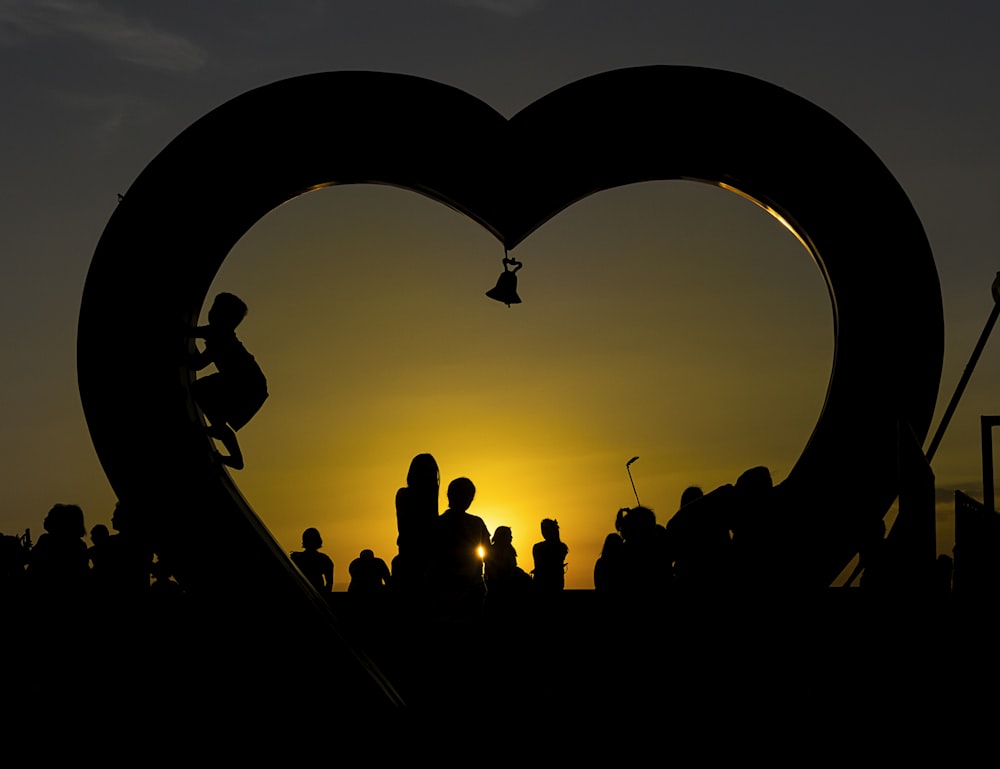 a heart shaped sculpture with a person on a skateboard