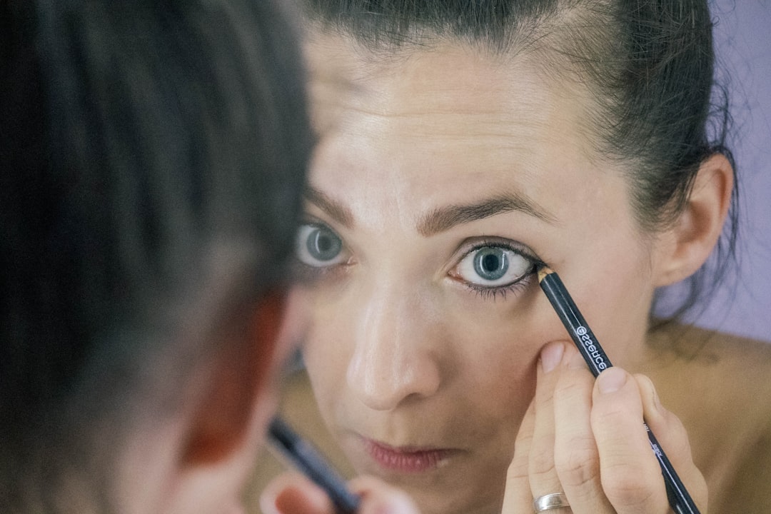 a woman is looking at her reflection in the mirror, Morning routine