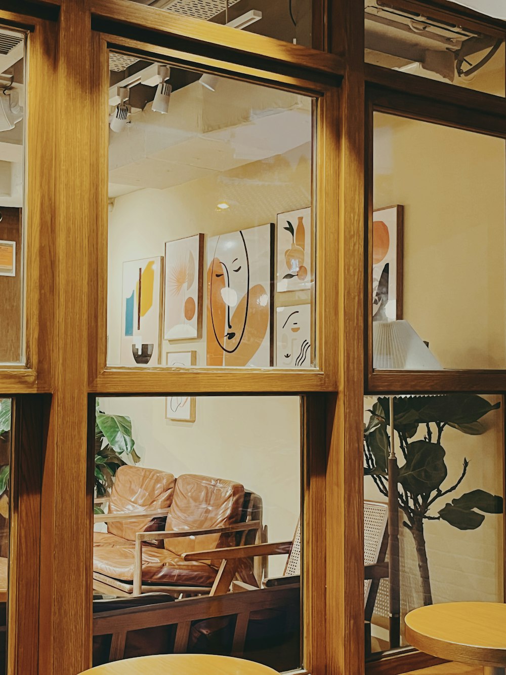 a living room filled with furniture and lots of windows