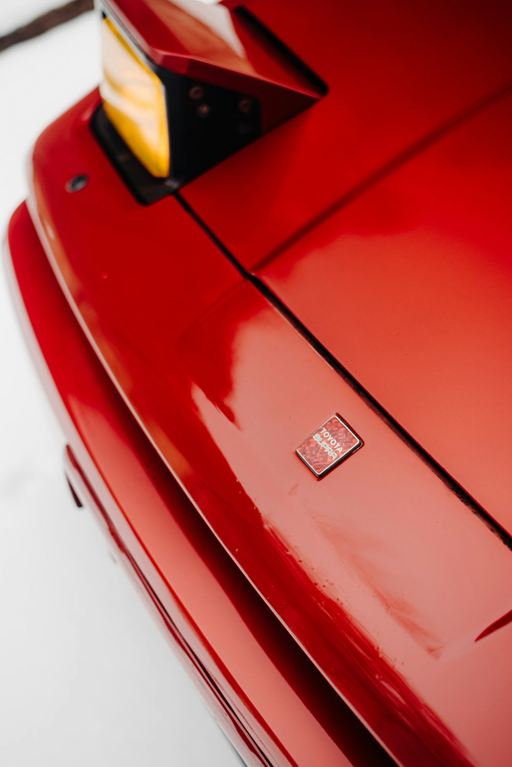 a close up of a red sports car