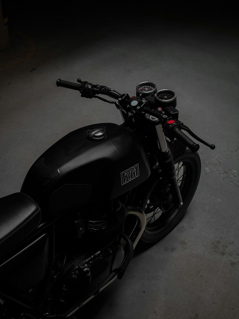 A black motorcycle parked in a dark room photo – Free Motorcycle Image on  Unsplash