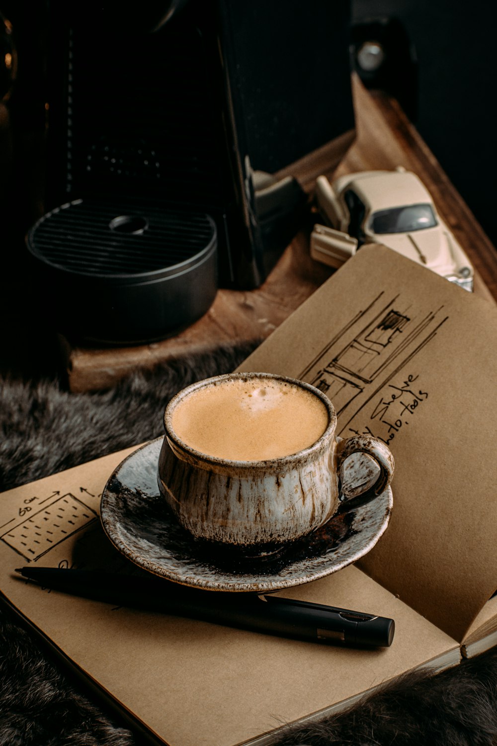 a cup of coffee sitting on top of a saucer